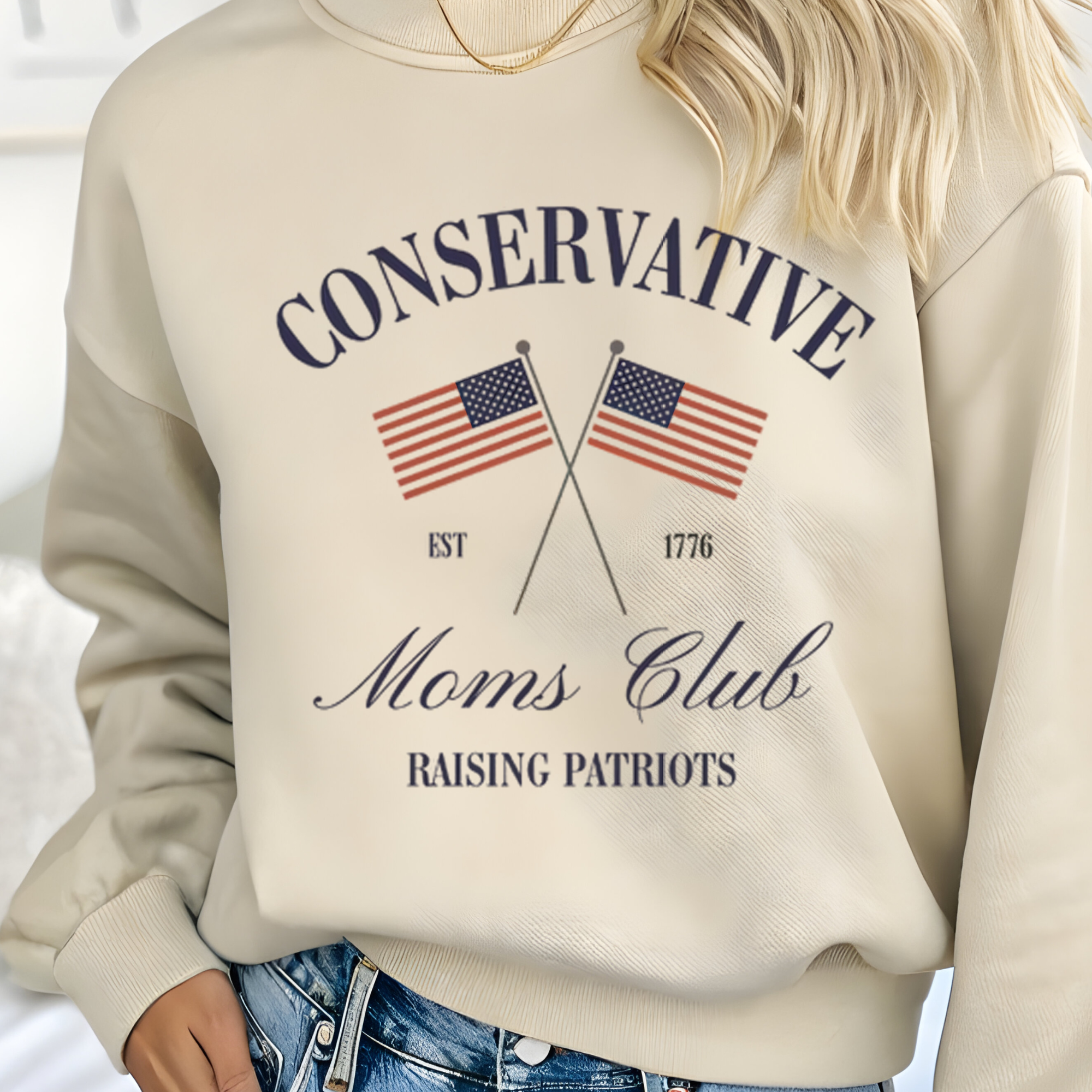 Cream pullover hoodie with patriotic graphic and Moms Club text