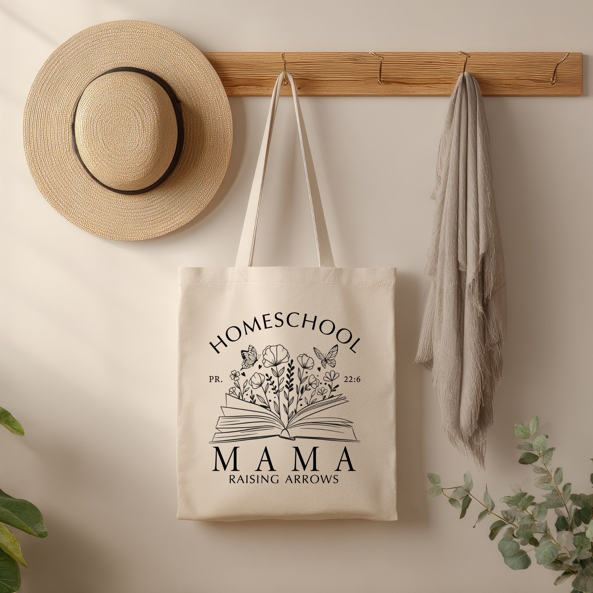 Cream canvas tote bag with homeschool book graphic and 'MAMA' text