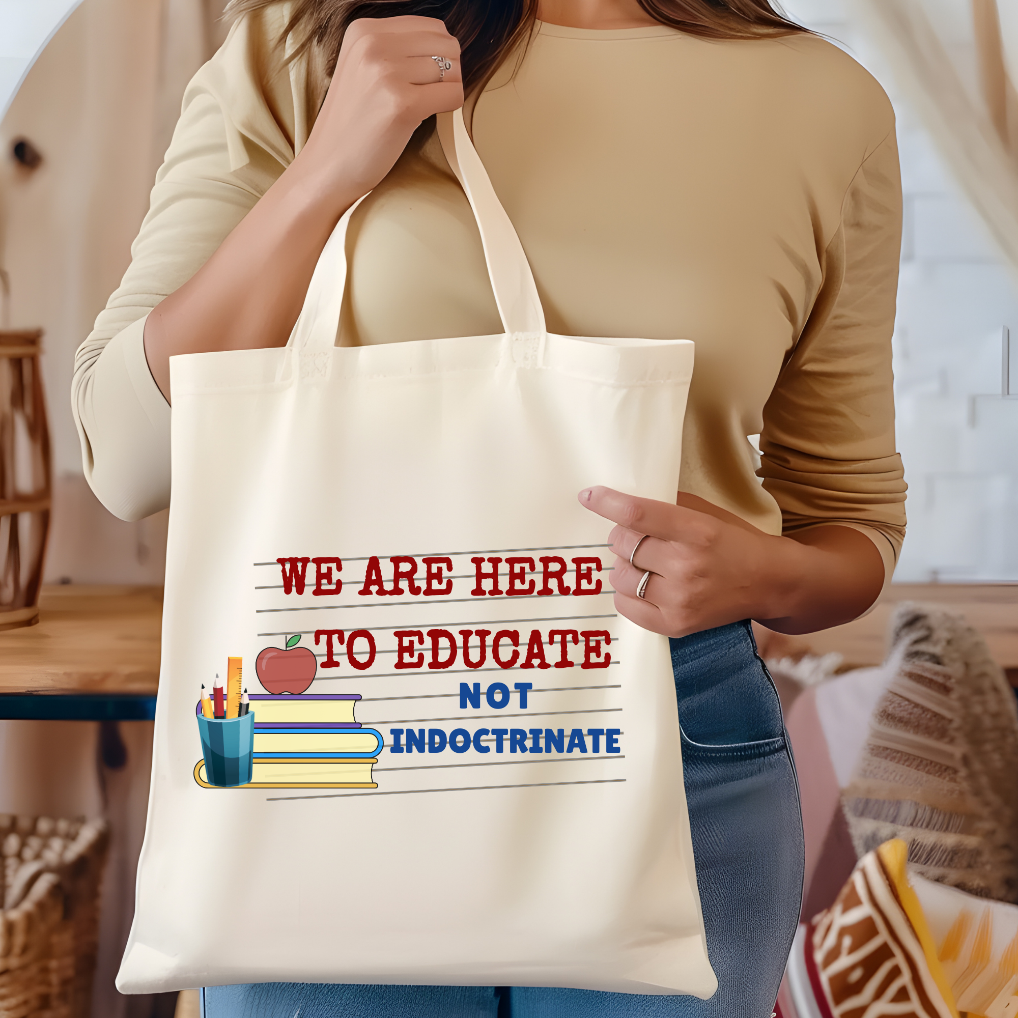 White tote bag with printed quote: We are here to educate, no indoctrinate