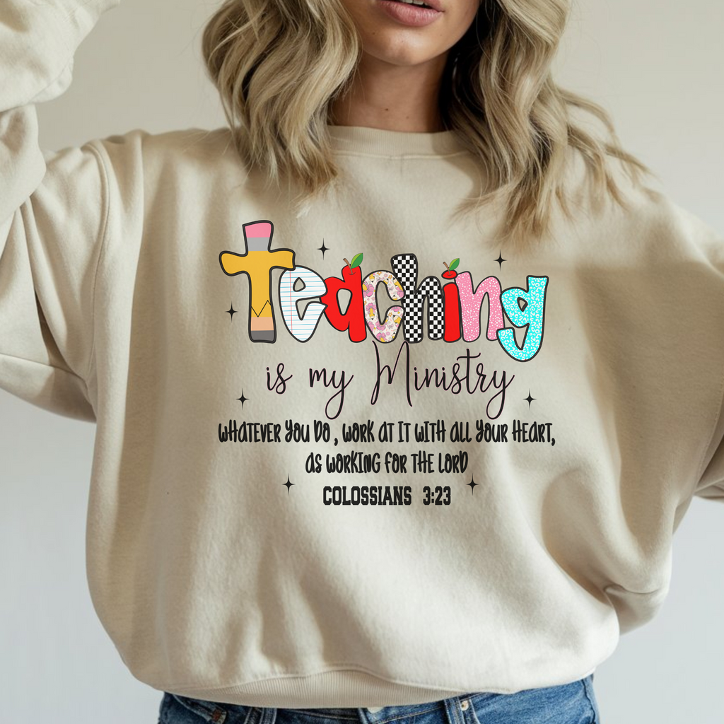Cream crewneck sweatshirt with colorful teaching graphic and crew collar