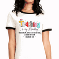White ringer T-shirt with black trim and colorful teaching-themed front graphic