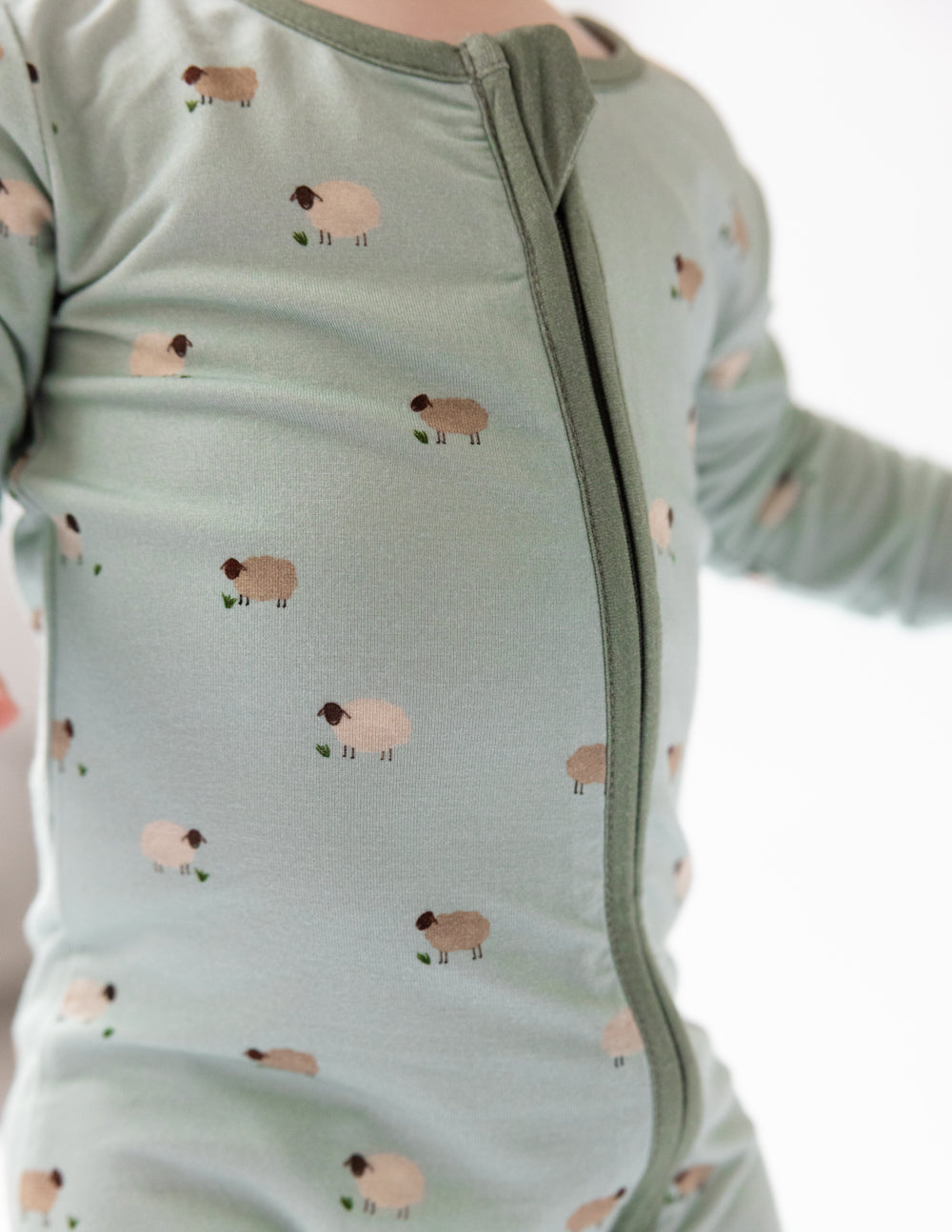 Sage green lamb-print convertible footed baby onesie with front zip