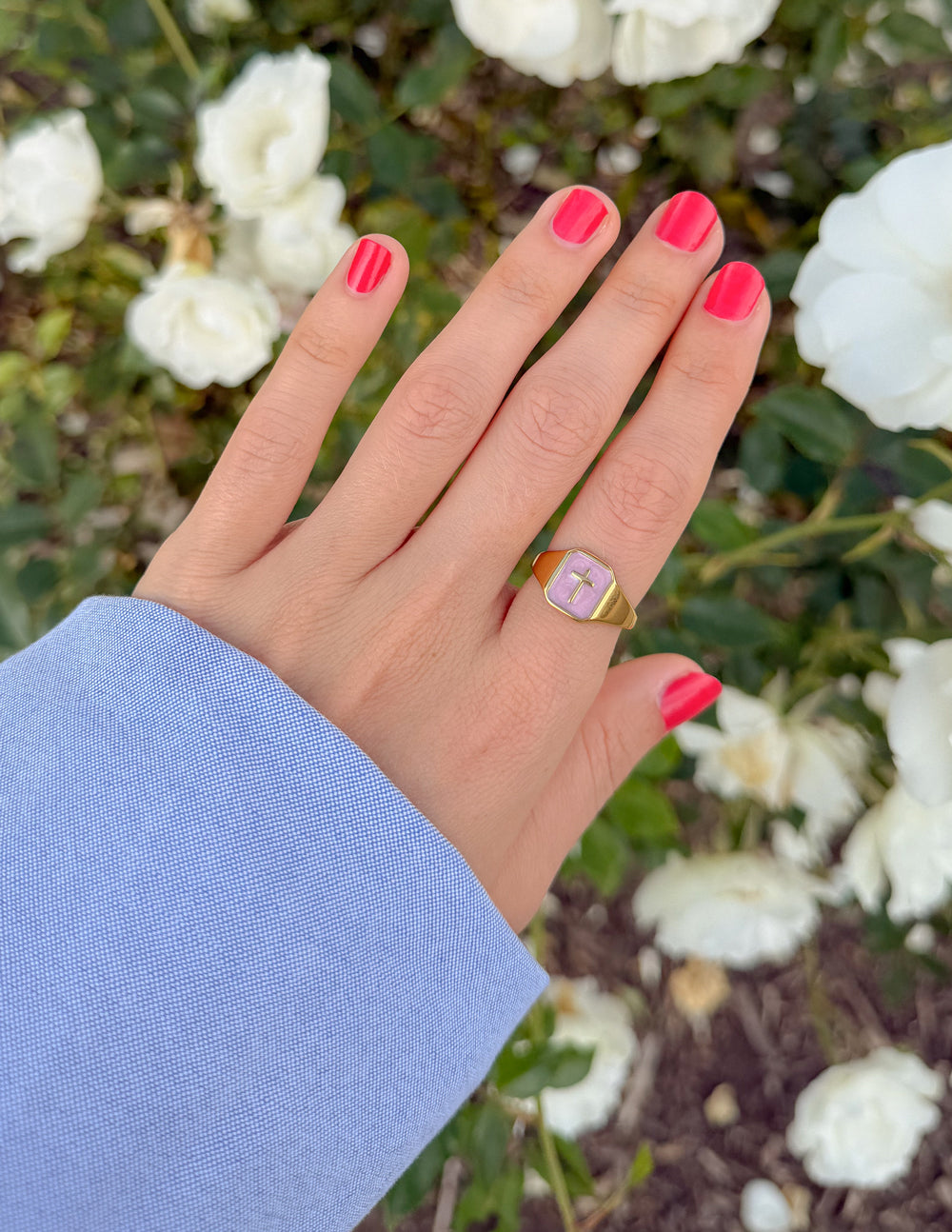 Lilac enamel cross ring on gold-tone band, worn on finger