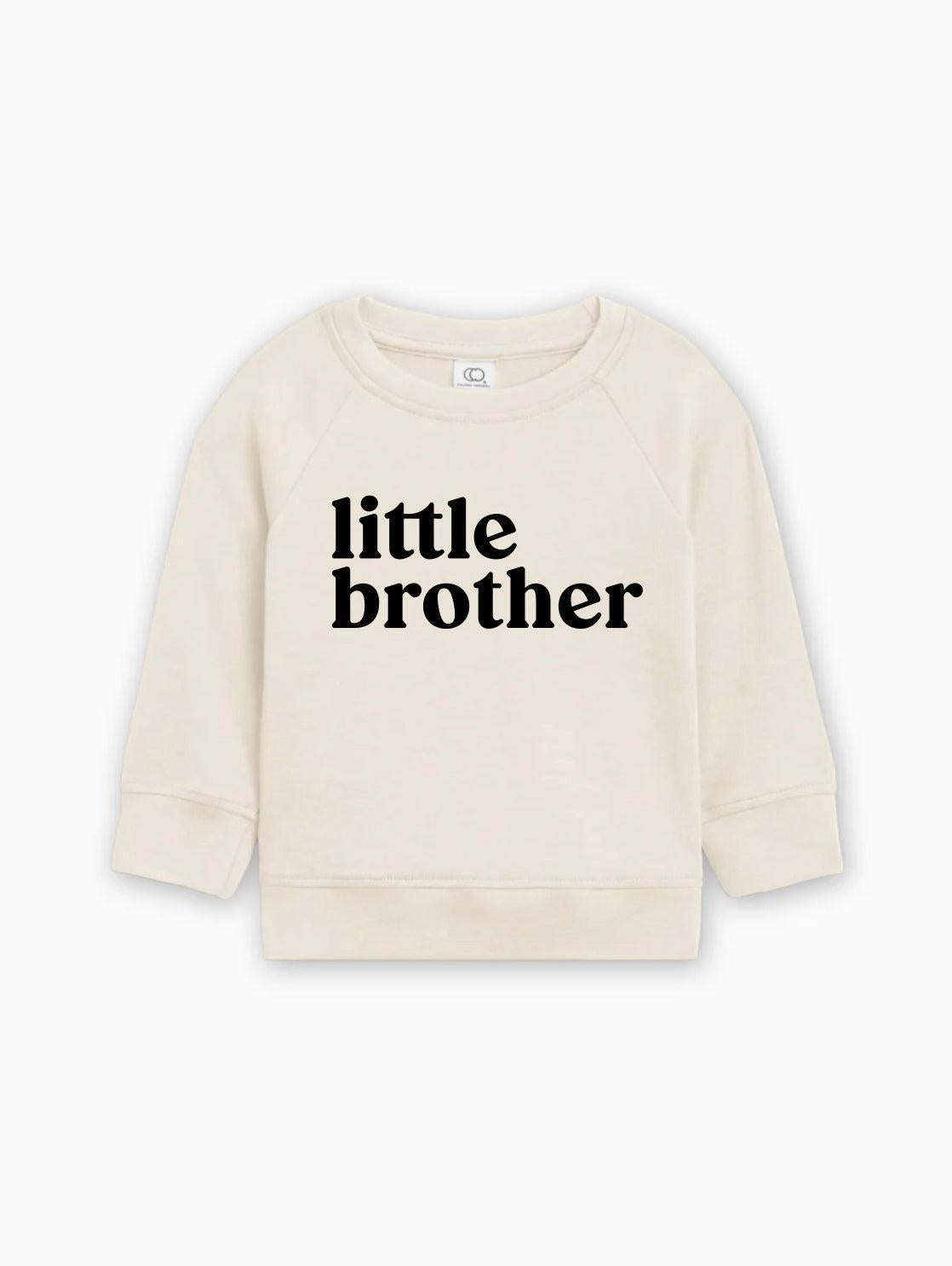 Natural cream baby pullover with long sleeves and 'little brother' text front