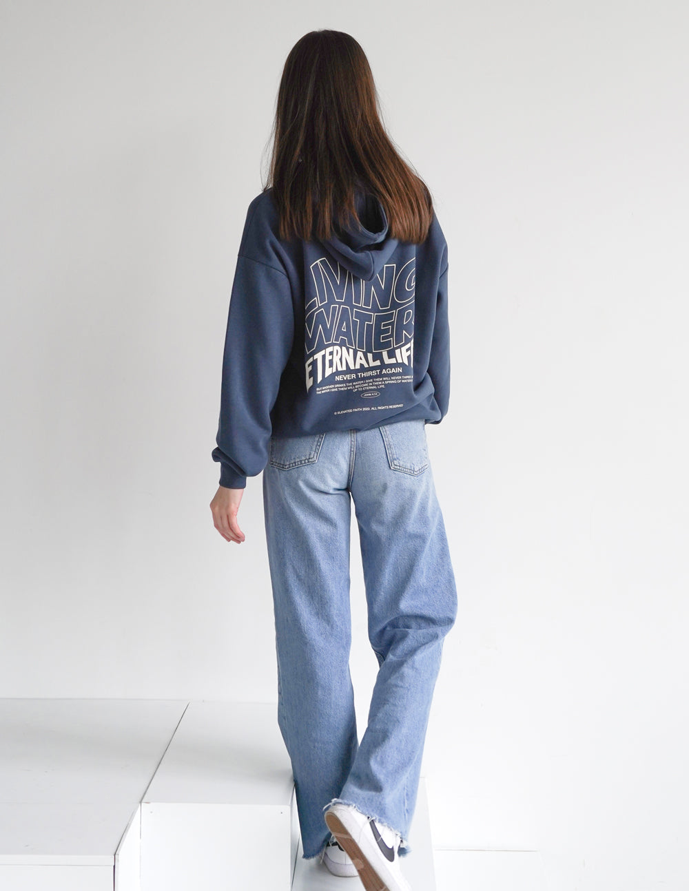 Dark blue unisex hoodie back view with Living Water Eternal Life logo text.