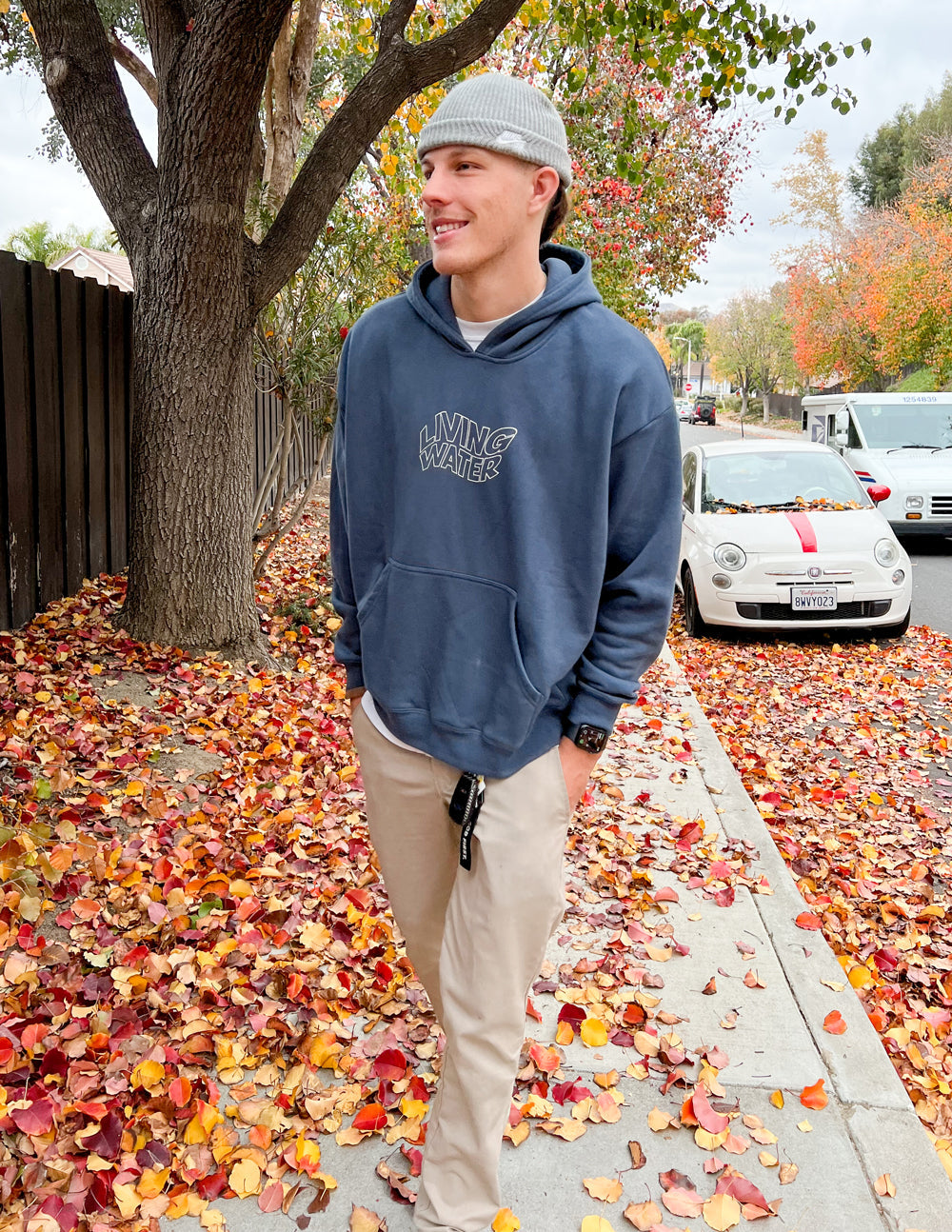 Dark blue unisex hoodie with front kangaroo pocket and small Living Water logo.