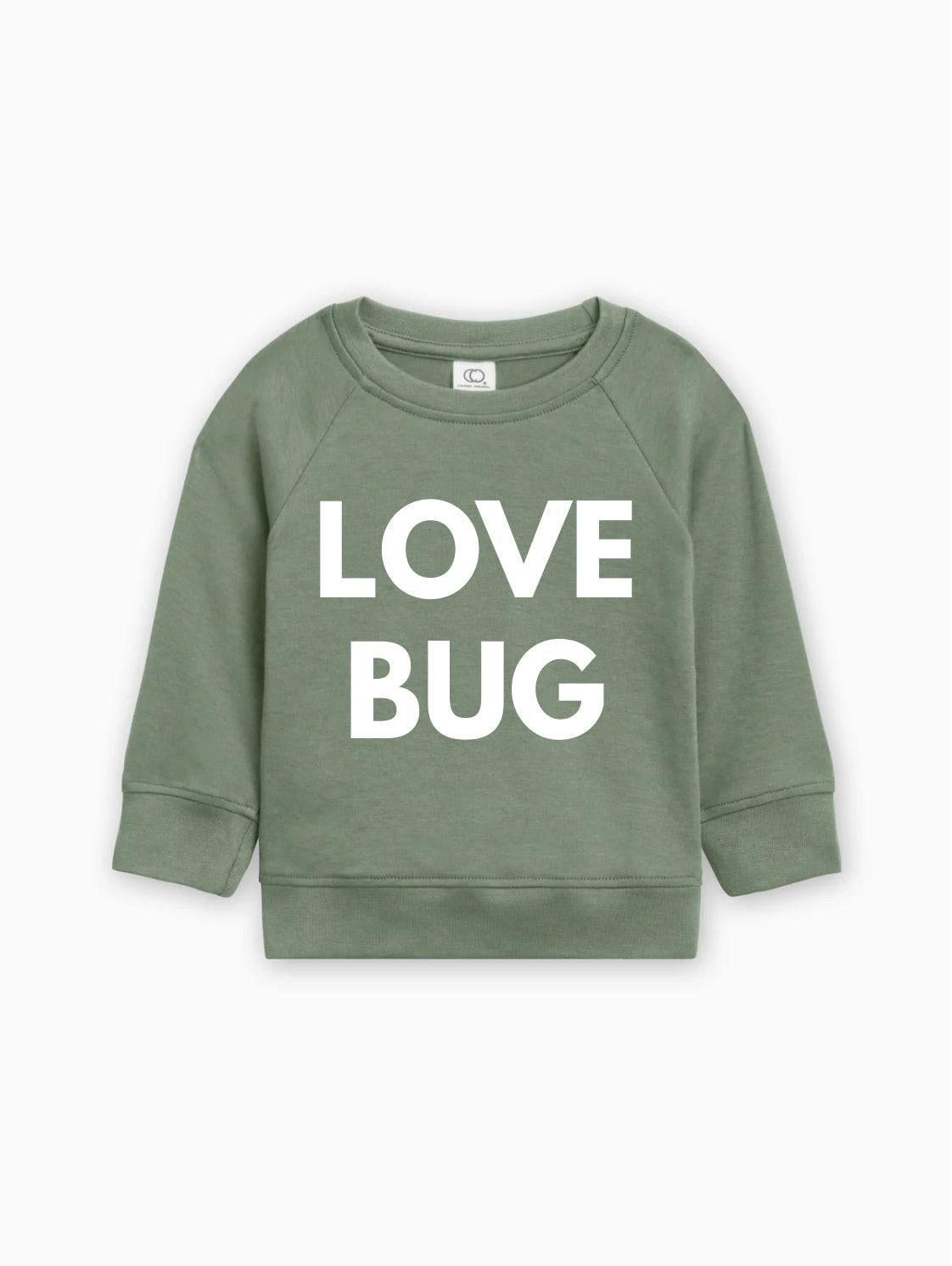 Green baby pullover with white “LOVE BUG” text graphic