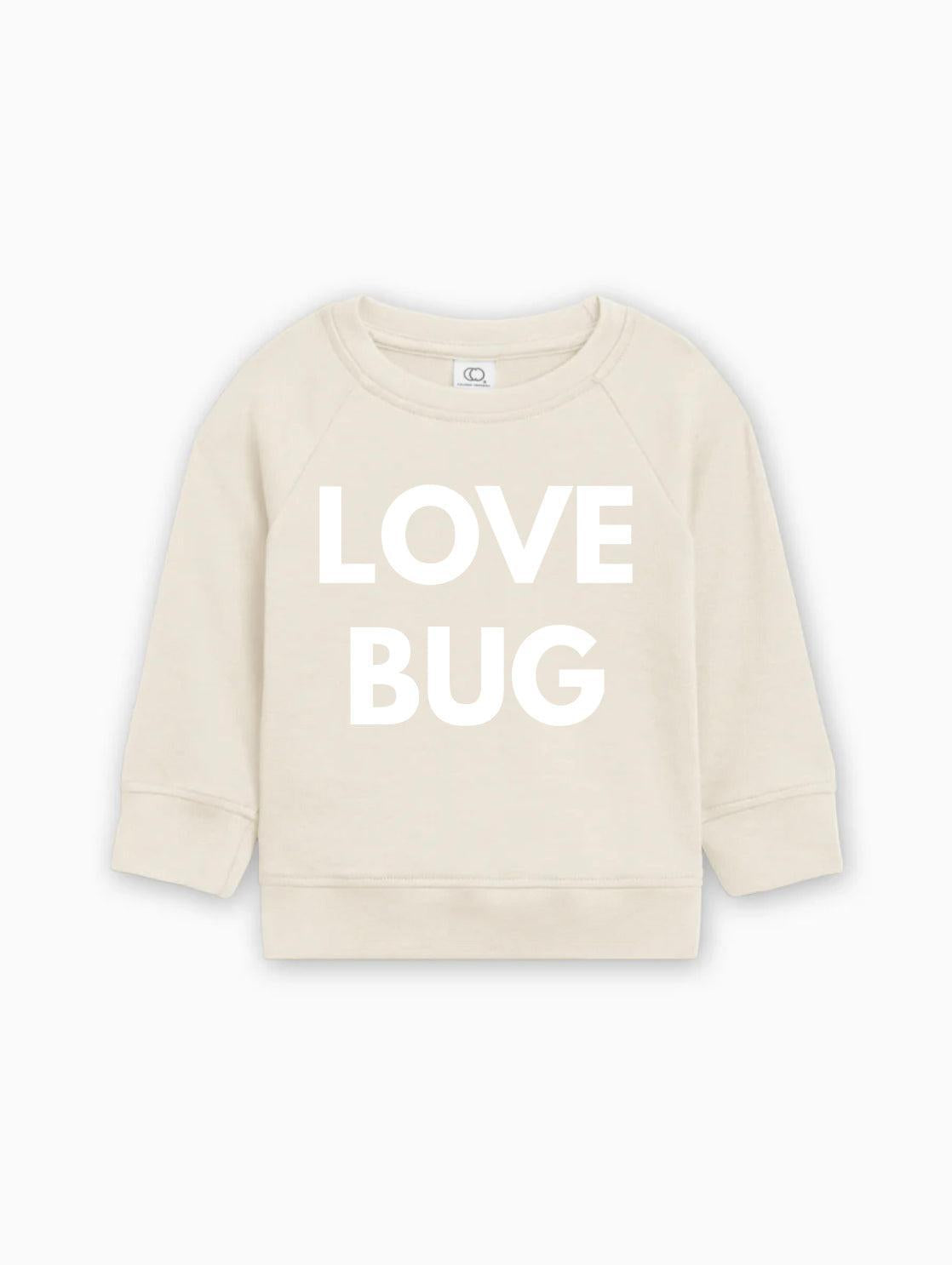 Cream baby pullover with white “LOVE BUG” text graphic