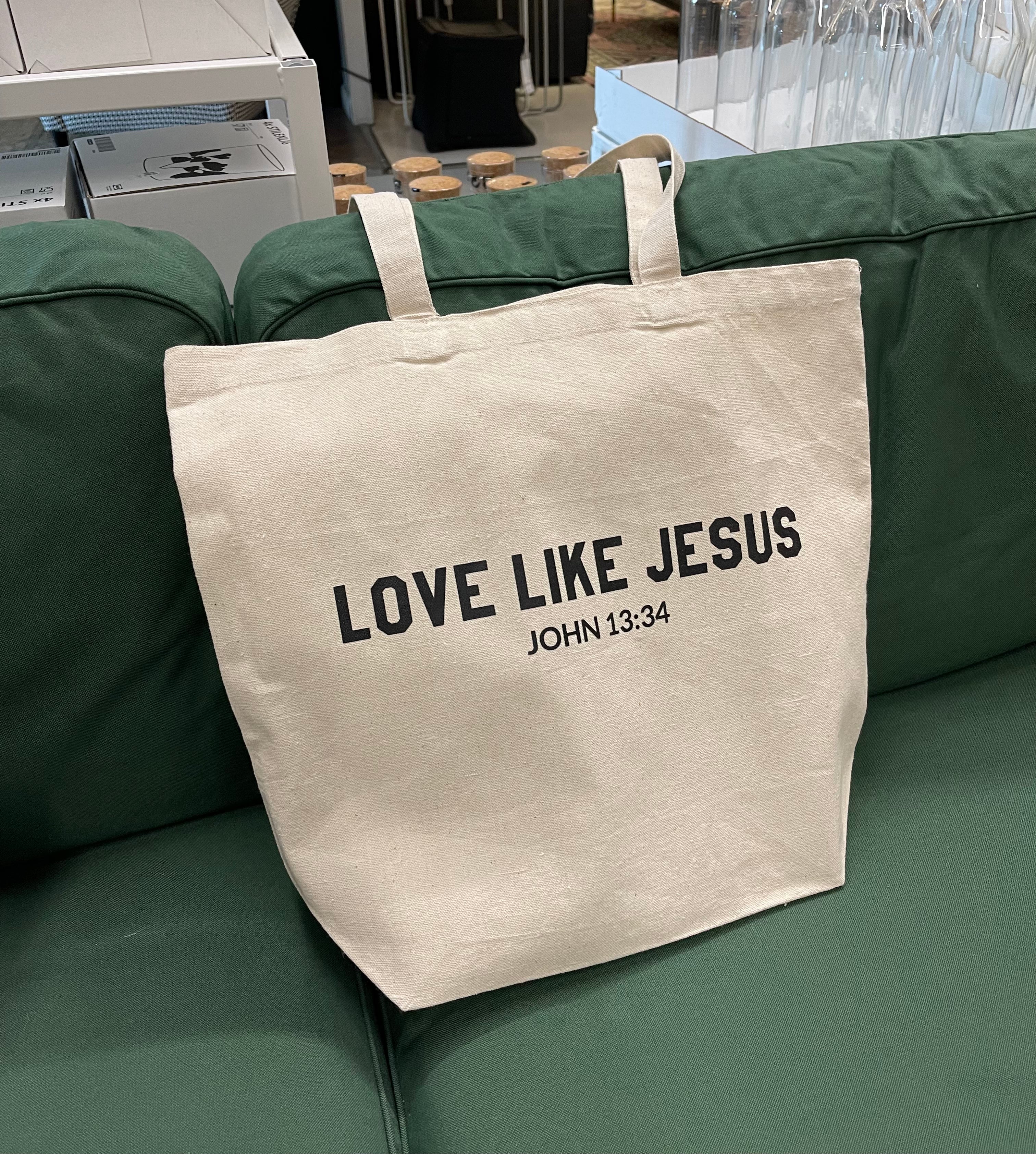 Natural canvas tote bag with front text LOVE LIKE JESUS, JOHN 13:34