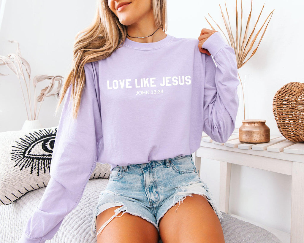 Long sleeve crewneck T-shirt in lavender with “LOVE LIKE JESUS” front print