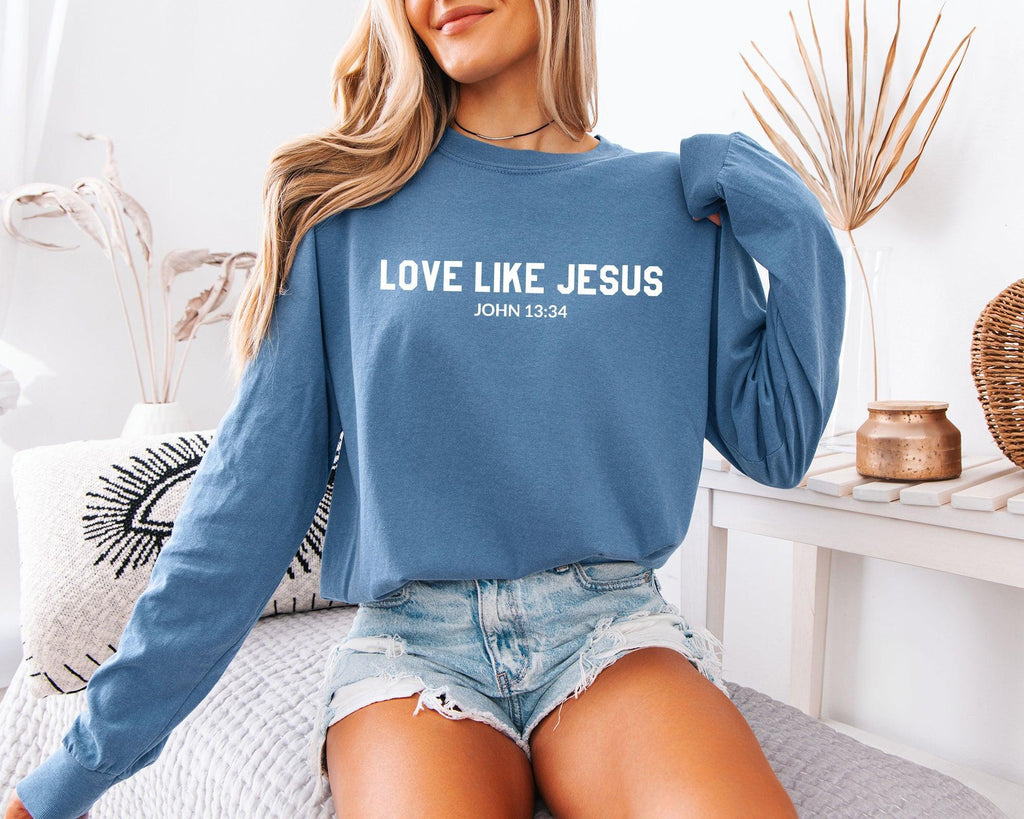 Long sleeve crewneck T-shirt in medium blue with “LOVE LIKE JESUS” front print