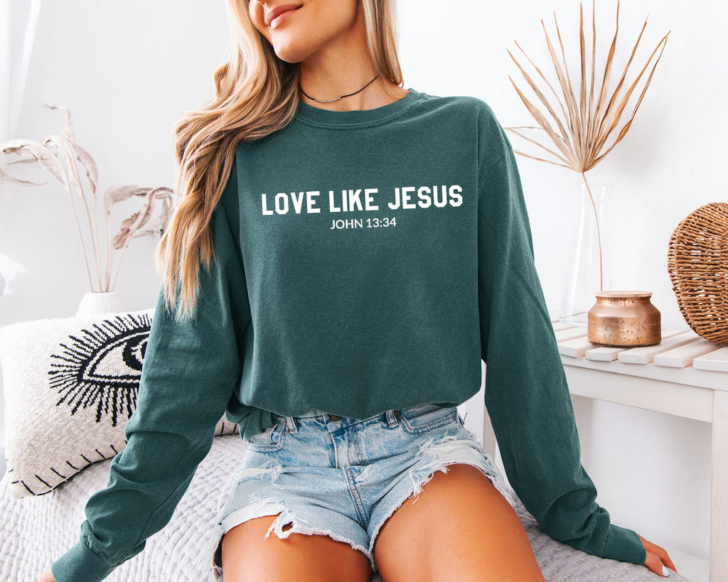 Long sleeve crewneck T-shirt in deep green with “LOVE LIKE JESUS” front print