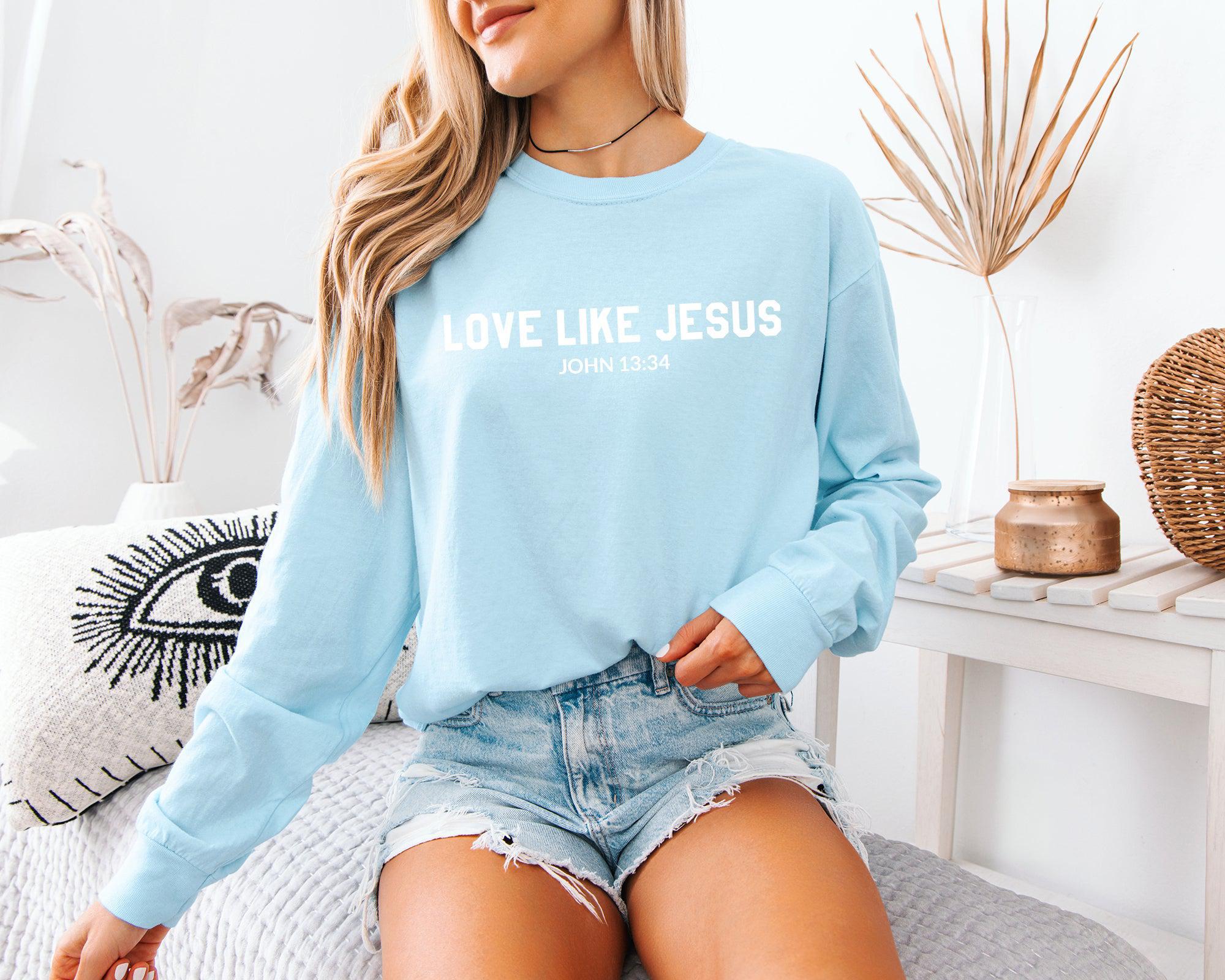 Long sleeve crewneck T-shirt in light blue with “LOVE LIKE JESUS” front print