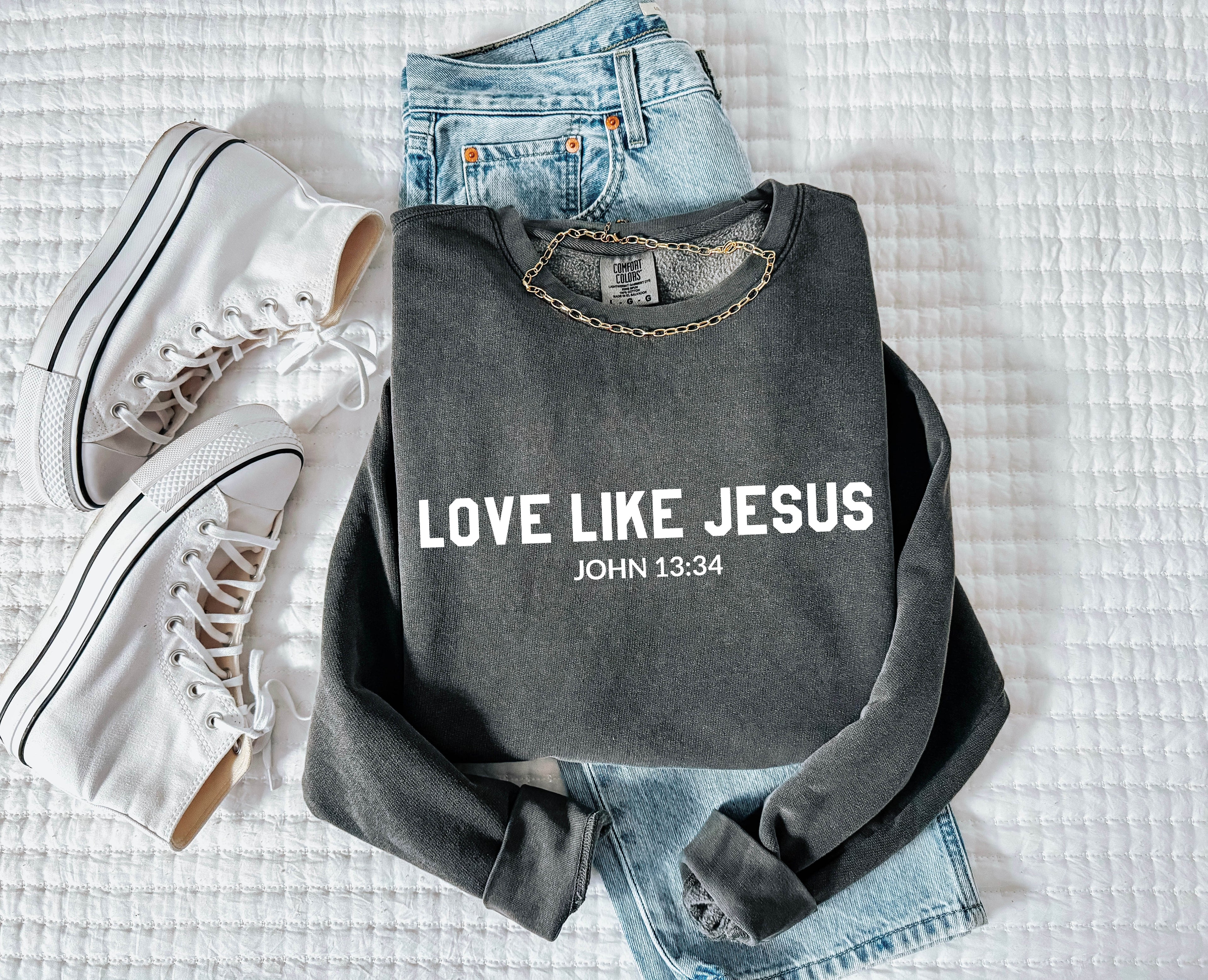 Charcoal crewneck sweatshirt with “LOVE LIKE JESUS” and “John 13:34” print