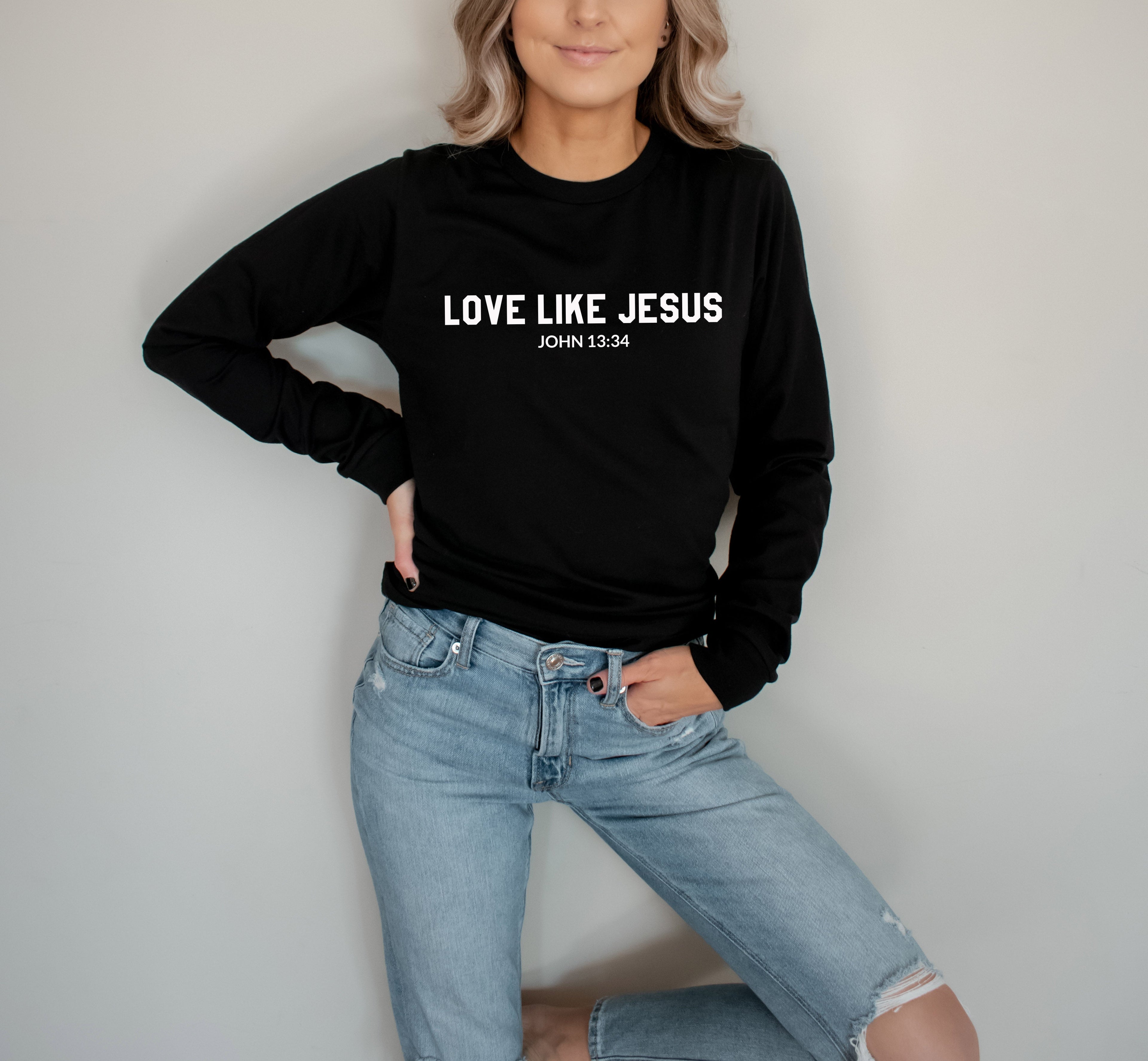 Long sleeve graphic T-shirt in black with "LOVE LIKE JESUS" and John 13:34