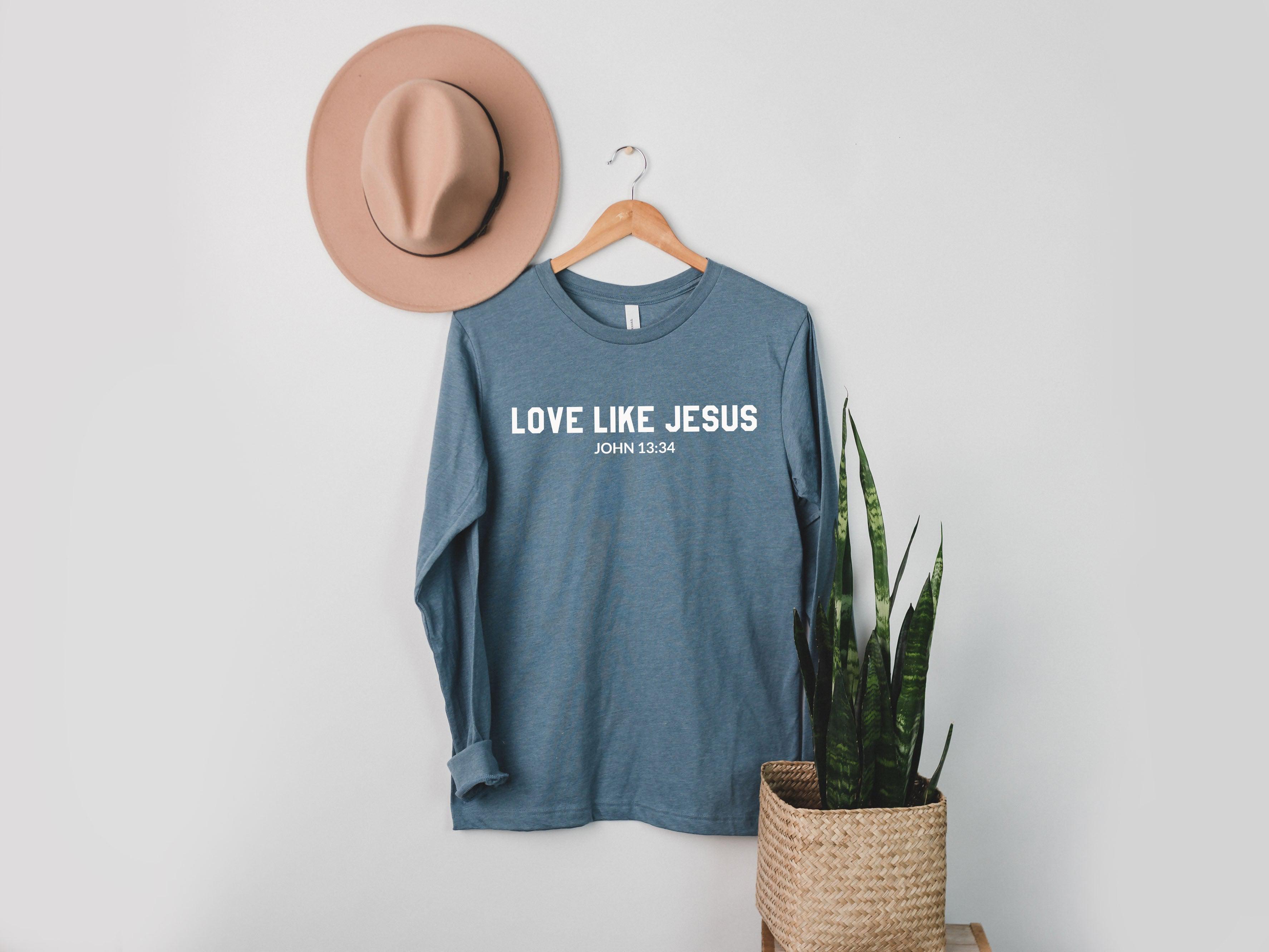 Long sleeve graphic T-shirt in heather blue with "LOVE LIKE JESUS" and John 13:34