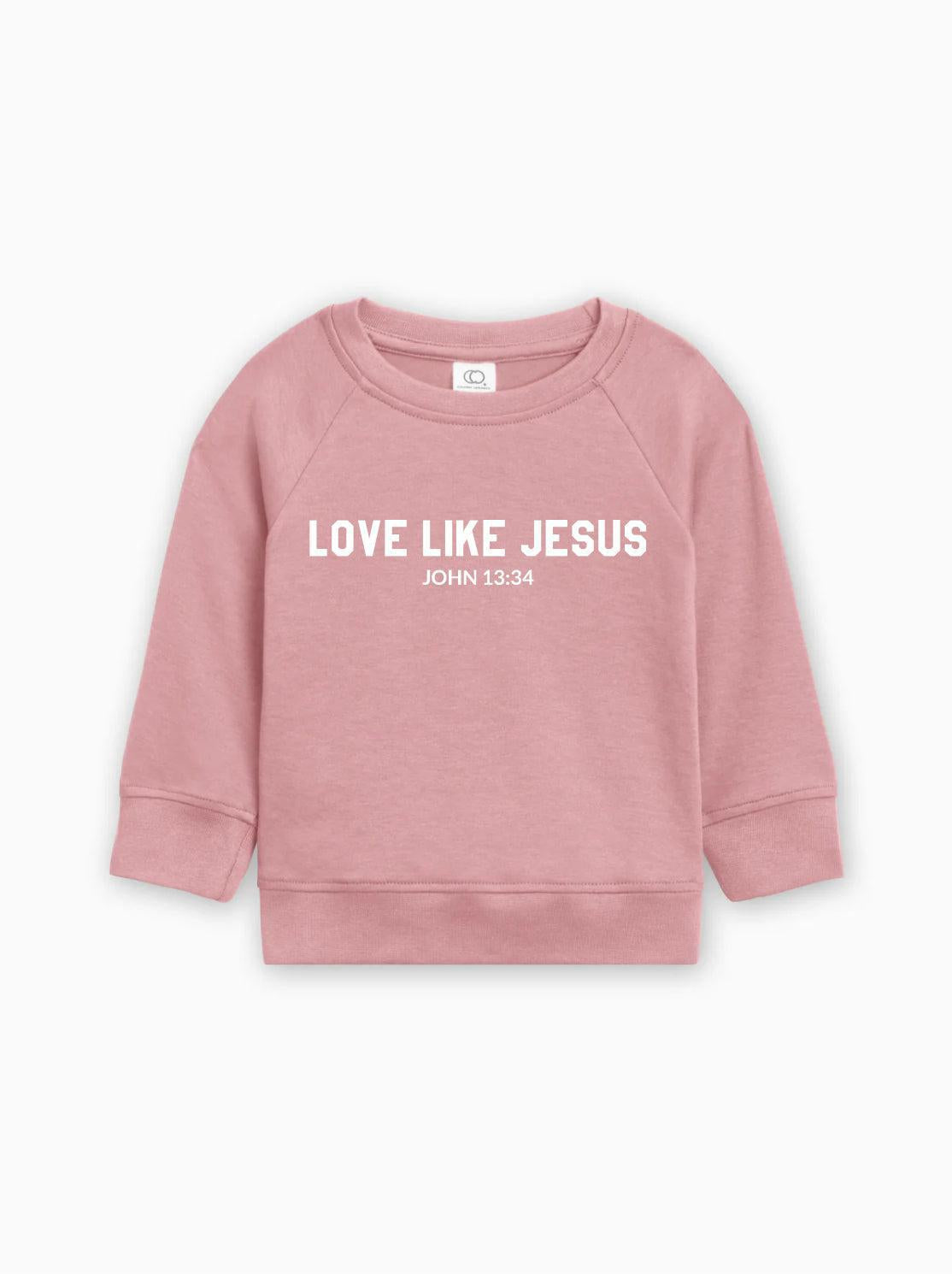 Toddler organic cotton pullover in light pink with “Love Like Jesus” graphic