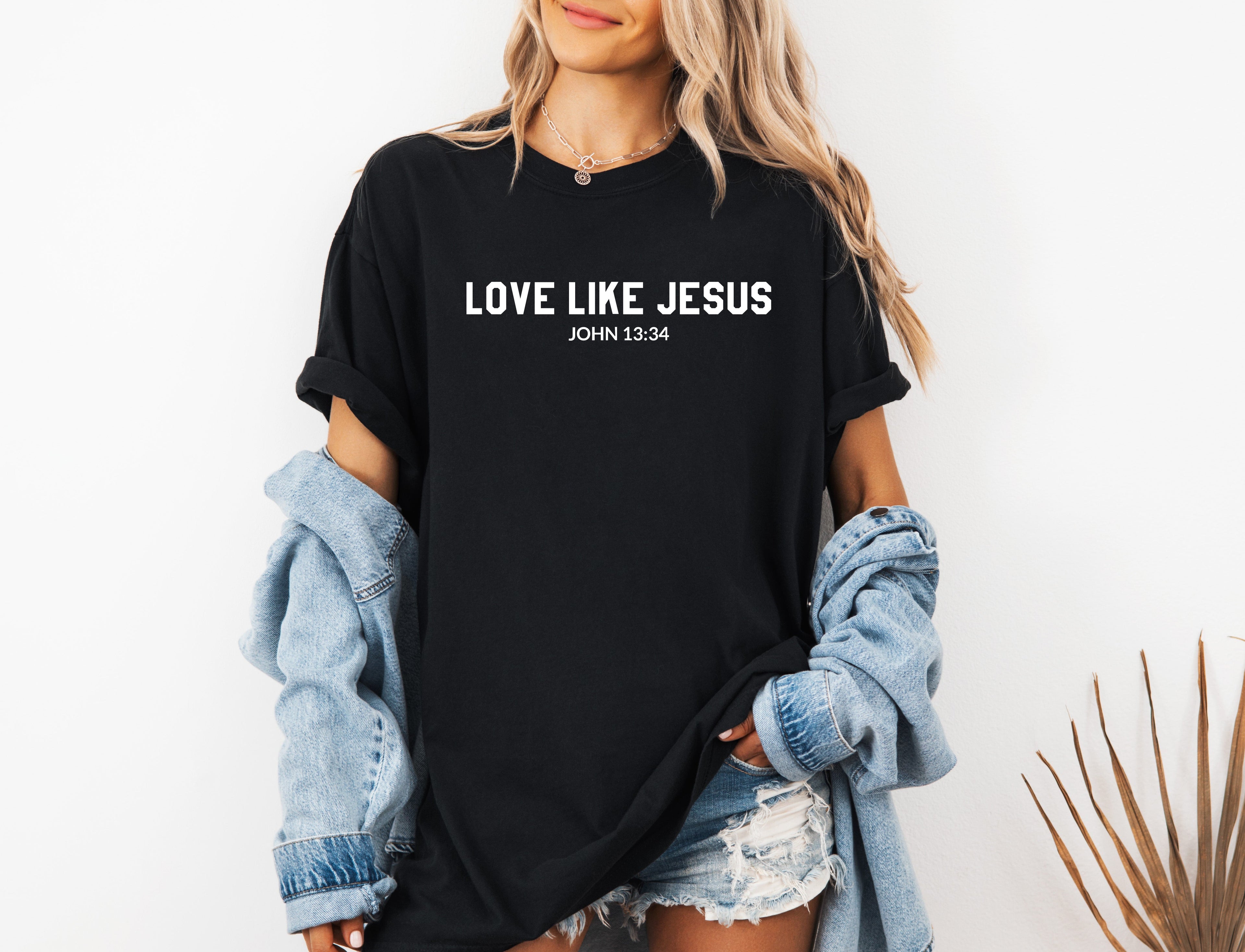 Black garment-dyed Christian T-shirt with printed “LOVE LIKE JESUS” and John 13:34