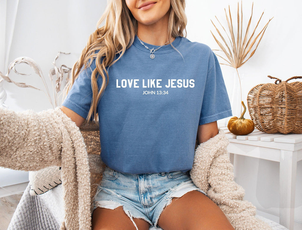 Blue crew-neck Christian graphic T-shirt with “LOVE LIKE JESUS” text on chest