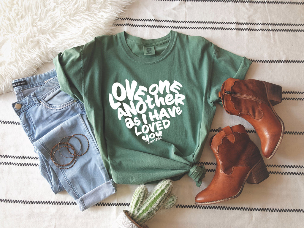 Unisex green crewneck T-shirt with white inspirational text graphic
