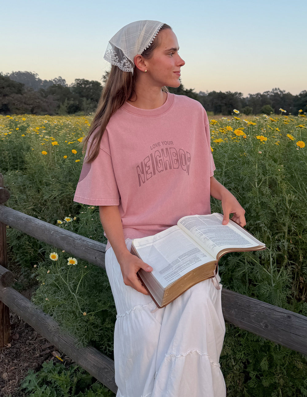Pink heavyweight T-shirt with crew neck and 'Neighbor' front graphic logo