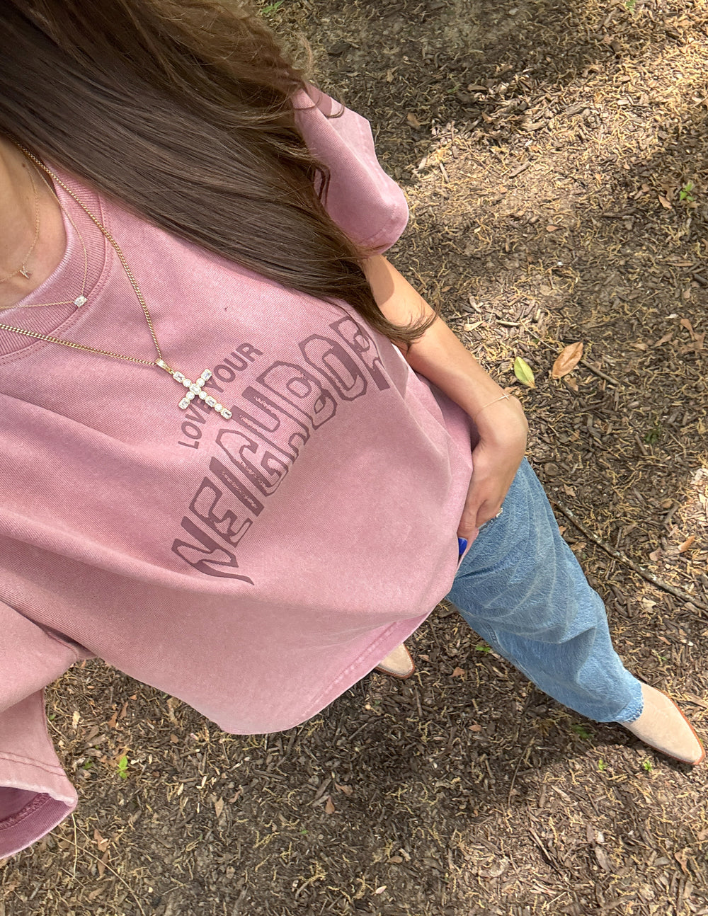 Pink heavyweight T-shirt with 'Neighbor' graphic logo, front detail and sleeves