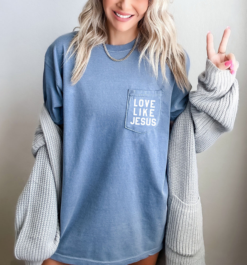 Short-sleeve pocket T-shirt, denim blue, with “LOVE LIKE JESUS” logo in front pocket.