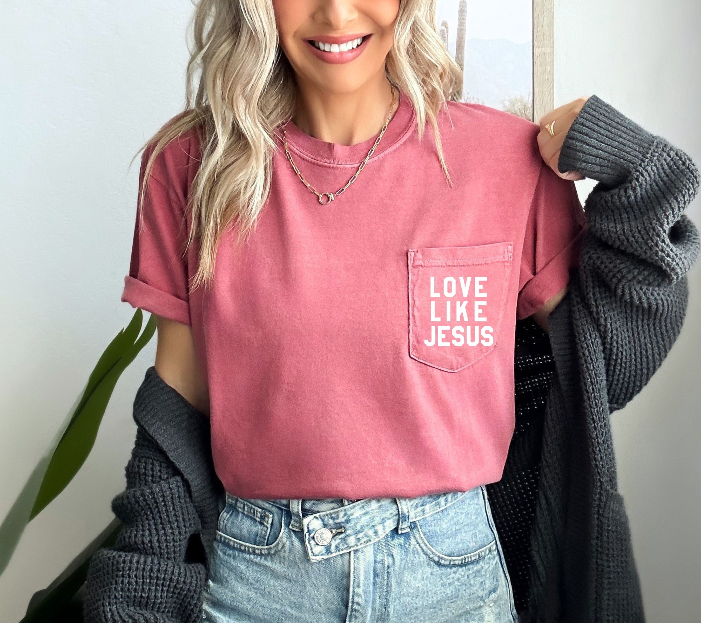 Short-sleeve pocket T-shirt, dusty rose, with “LOVE LIKE JESUS” logo in chest pocket.