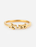 Gold-tone Loved ring with cutout lettering on a smooth band
