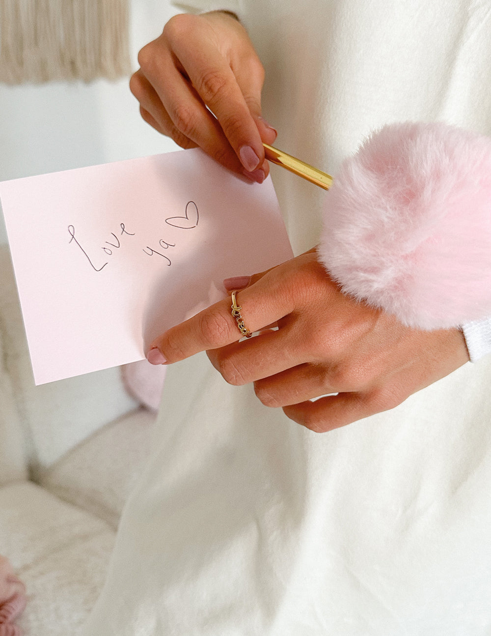 Gold-tone Loved ring with engraved Loved lettering on finger