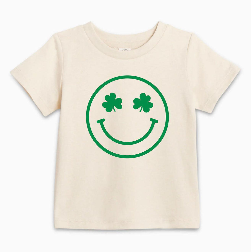 Natural baby T-shirt with green smiley clover face graphic, short sleeves