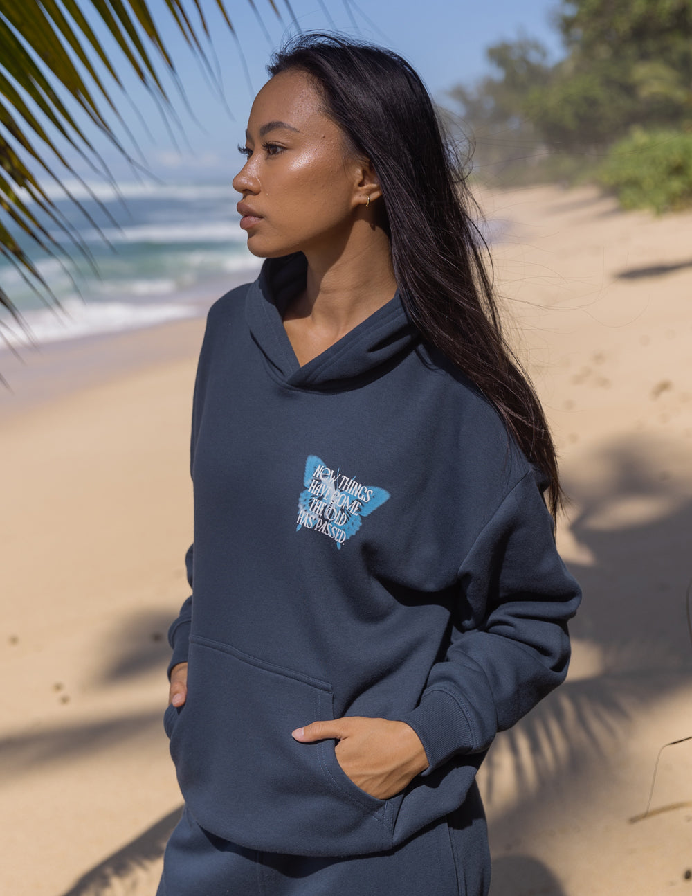 Unisex dark navy hoodie with butterfly chest graphic, kangaroo pocket and hood