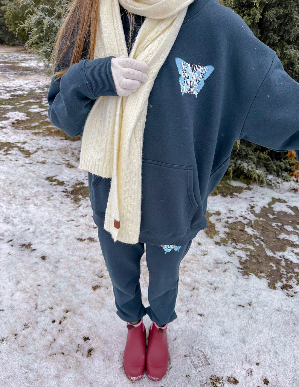 Unisex dark navy hoodie front view with butterfly chest logo, kangaroo pocket