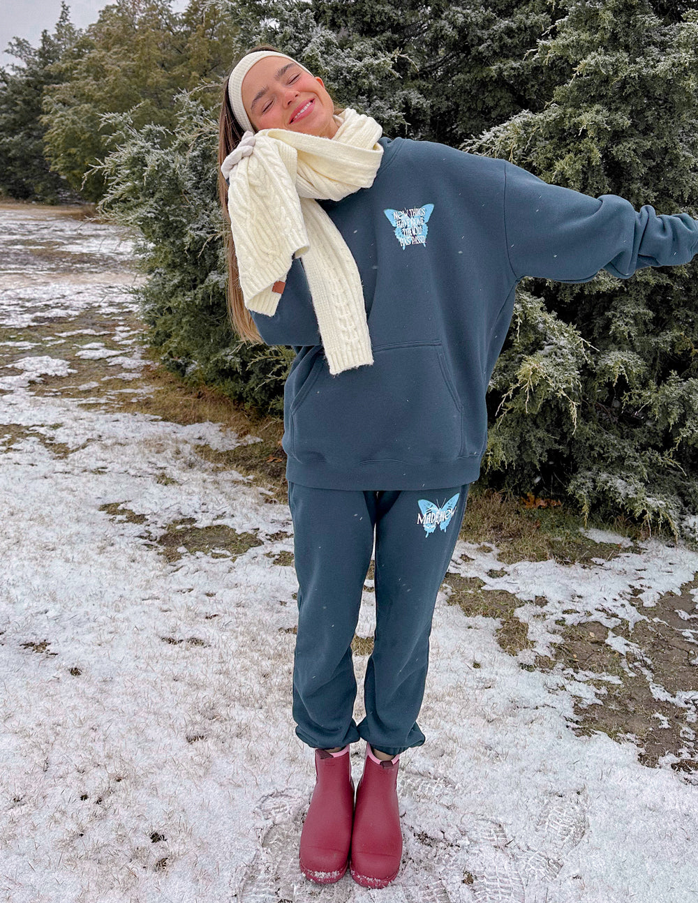 Dark blue unisex sweatpants with butterfly prints, elastic waistband and ankle cuffs