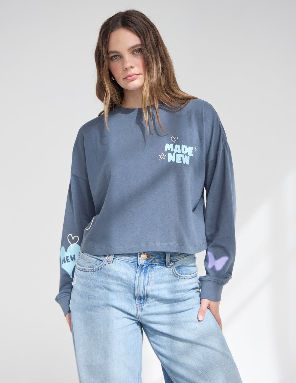 Blue cropped long-sleeve T-shirt with heart and 'MADE NEW' logo