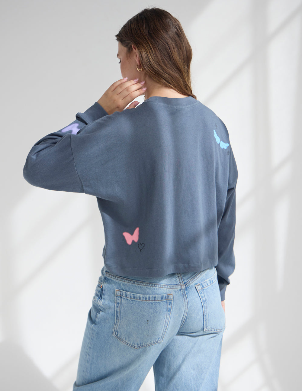 Cropped long-sleeve tee, dark blue, small “NEW” heart and butterfly prints on back
