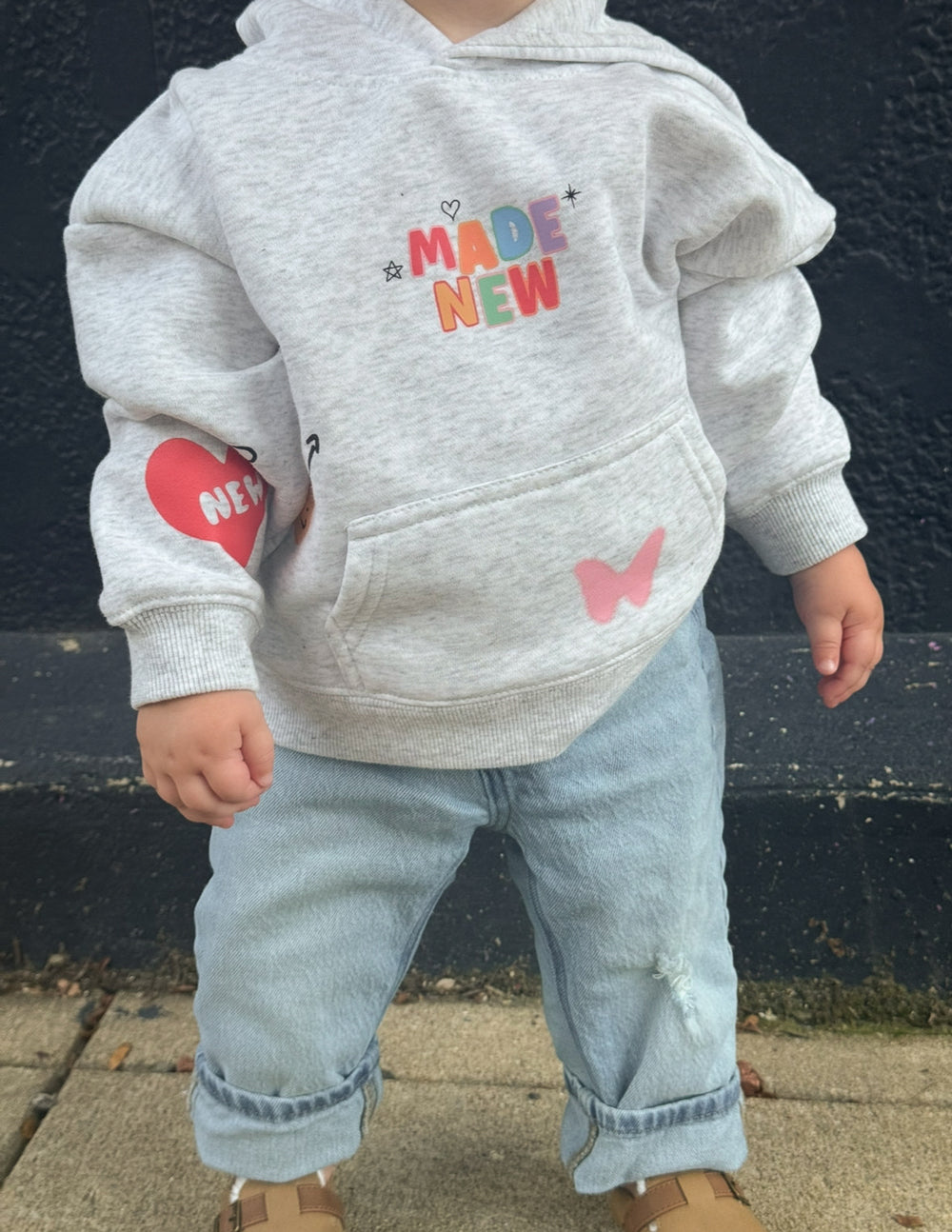 Kids light gray hoodie with hood, kangaroo pocket, and colorful graphic details
