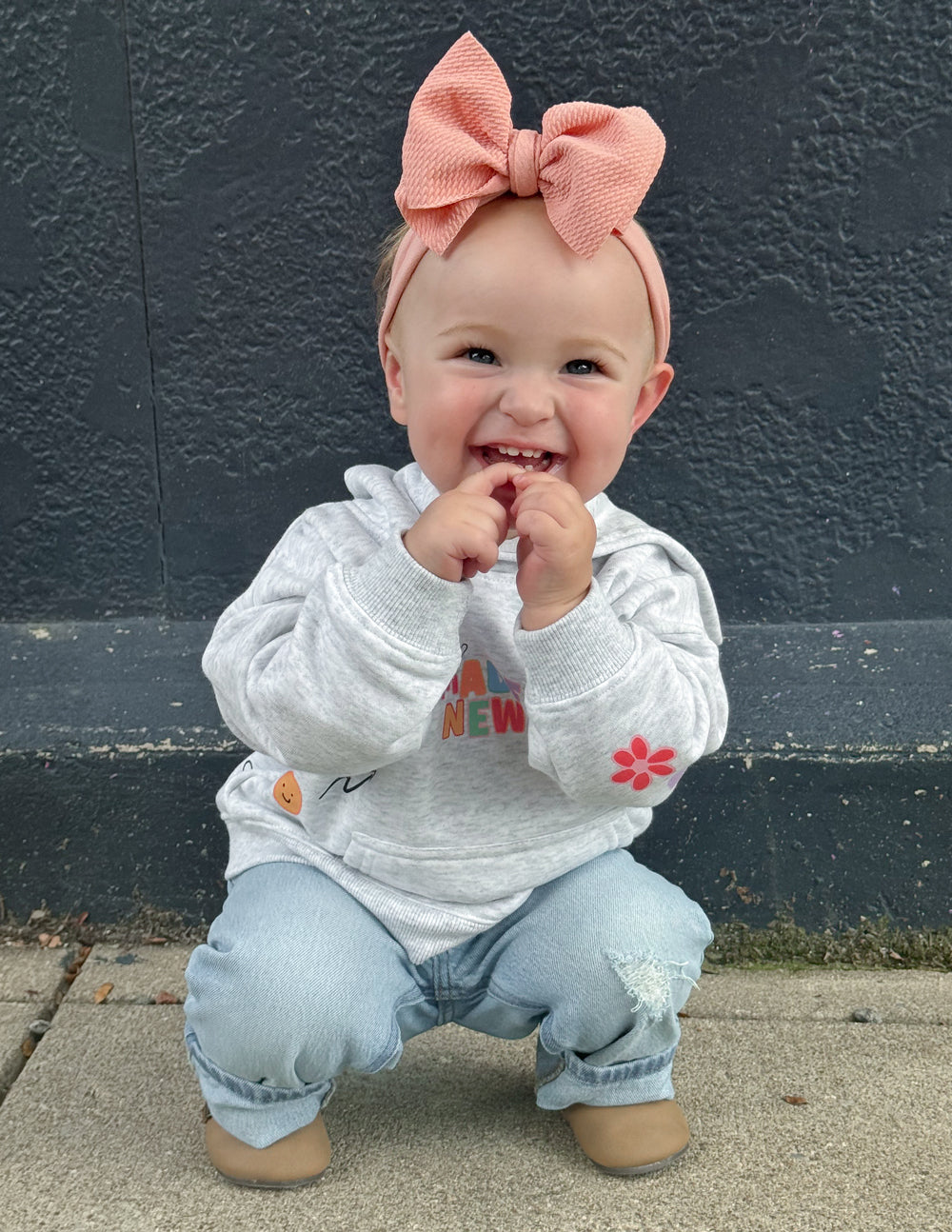 Kids light gray hoodie with colorful paw and heart prints
