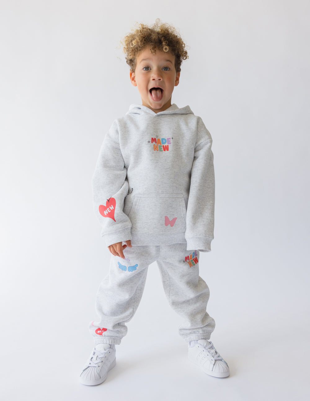 Kids gray sweatpants with elastic cuffs and colorful heart, whale, and star prints