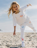 Kids grey long-sleeve tee with small 'MADE NEW' print and heart graphics