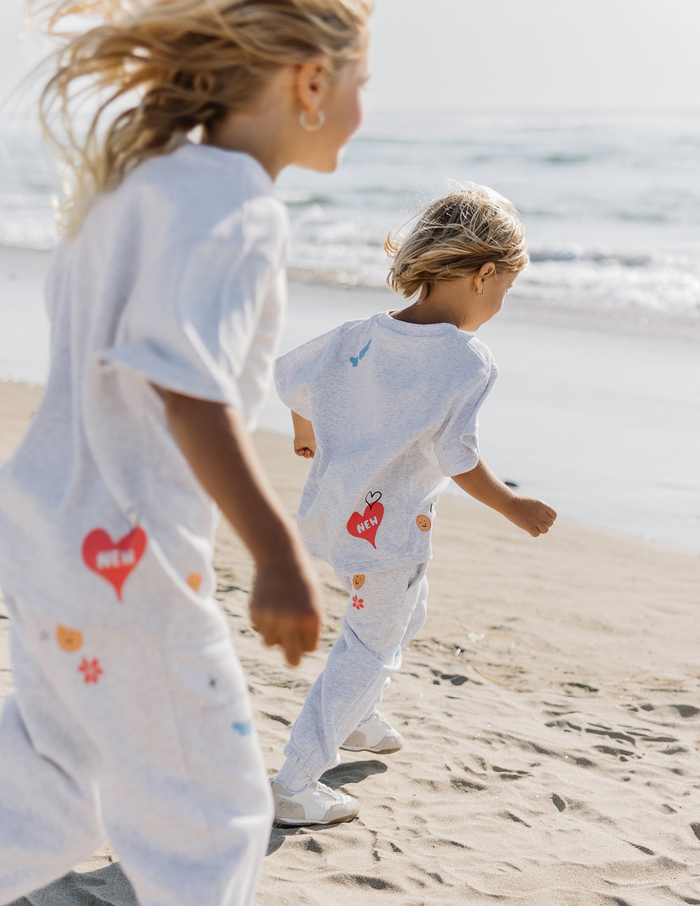 Kids grey tee back and front with heart and 'MADE NEW' prints in color