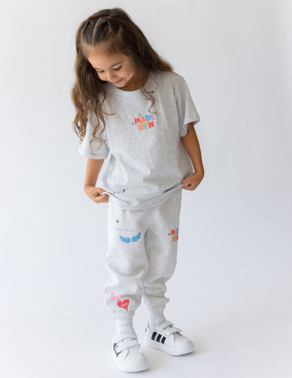 Kids grey tee with 'MADE NEW' chest graphic and small multi-color icons