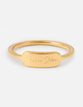Gold ring with engraved “Made New” band detail