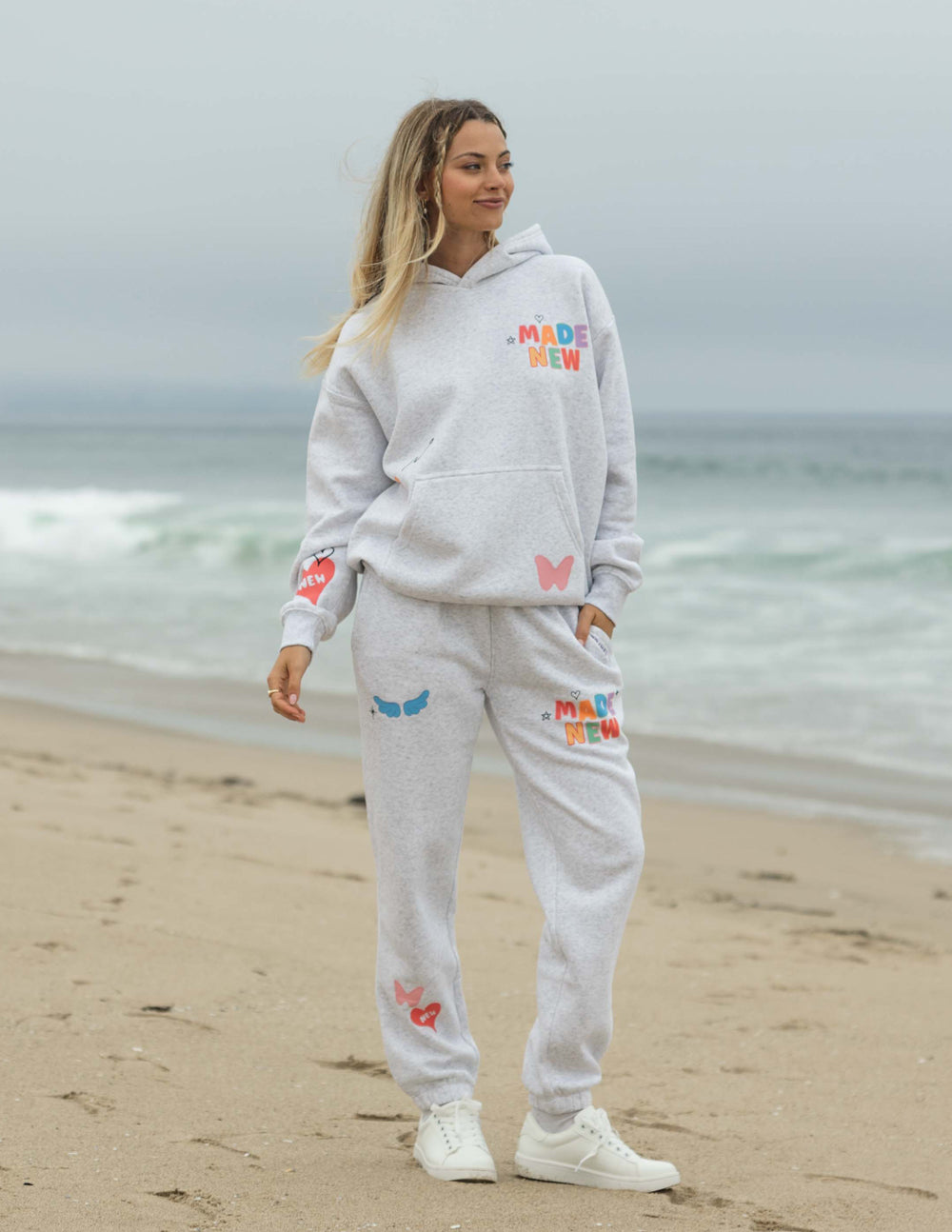 Light gray unisex hoodie with colorful chest logo, hood and front pocket