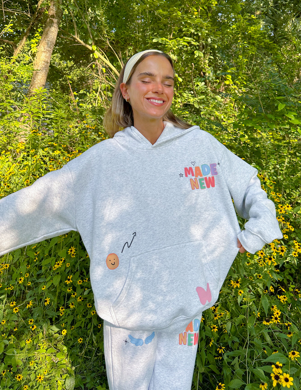 Light gray unisex hoodie with colorful chest logo, hood and kangaroo pocket