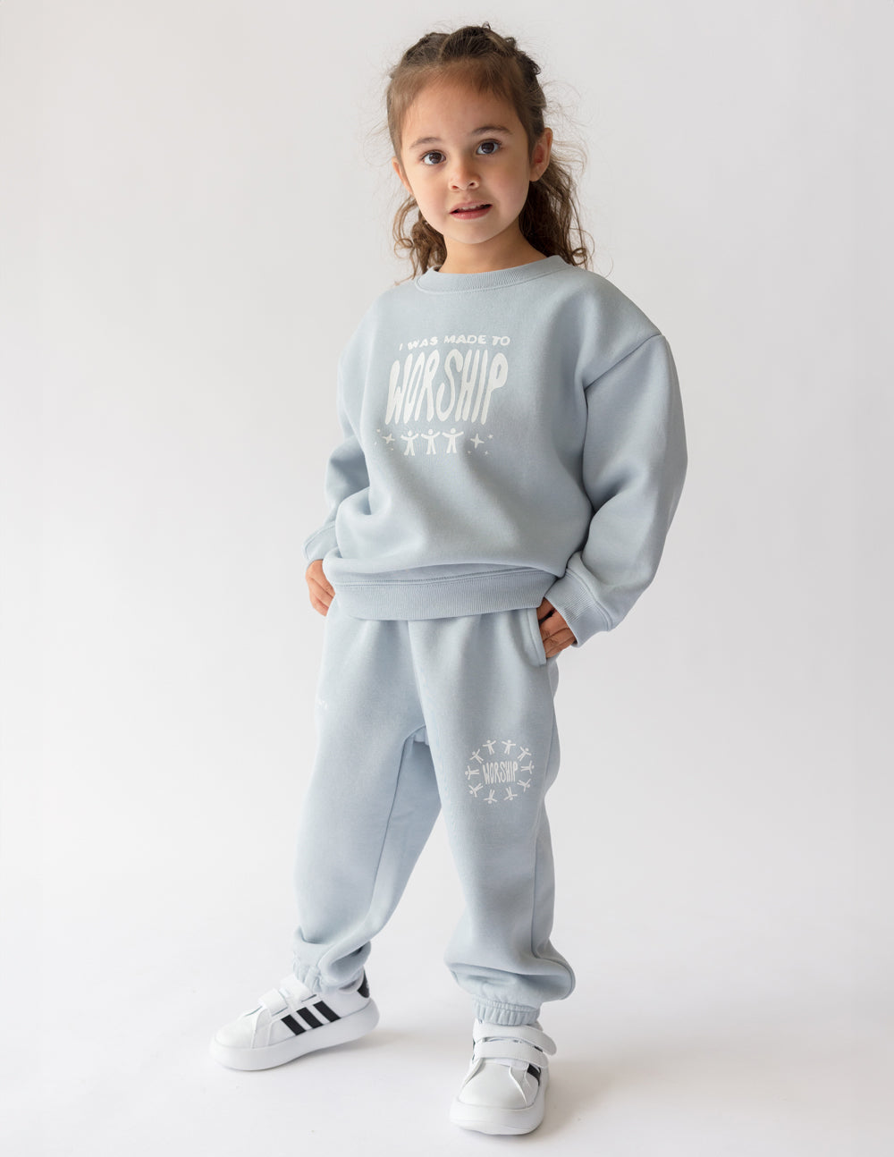 Kids crewneck sweatshirt, light blue; front “worship” graphic centered