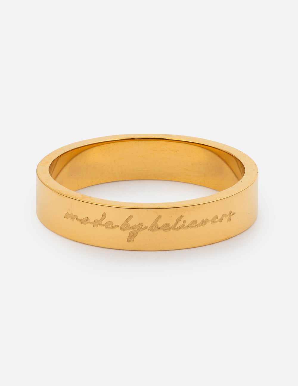 Gold-tone engraved band ring with cursive lettering