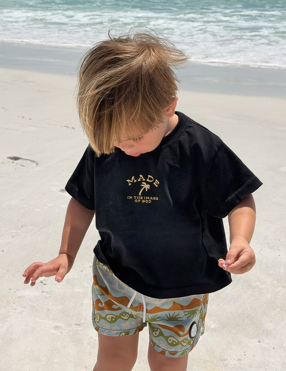 Kids black graphic tee with gold back logo and scripture text