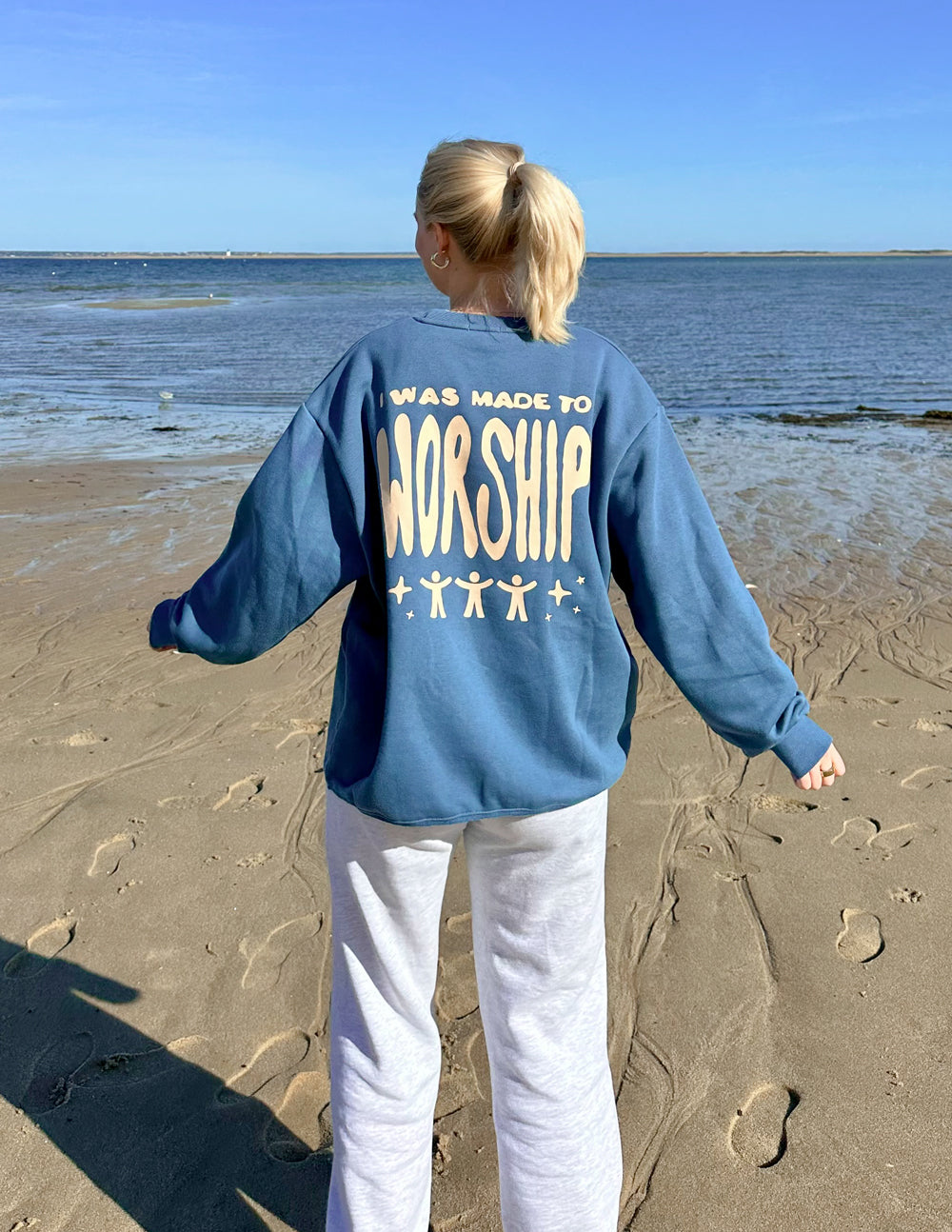 Blue unisex crewneck sweatshirt with worship back graphic