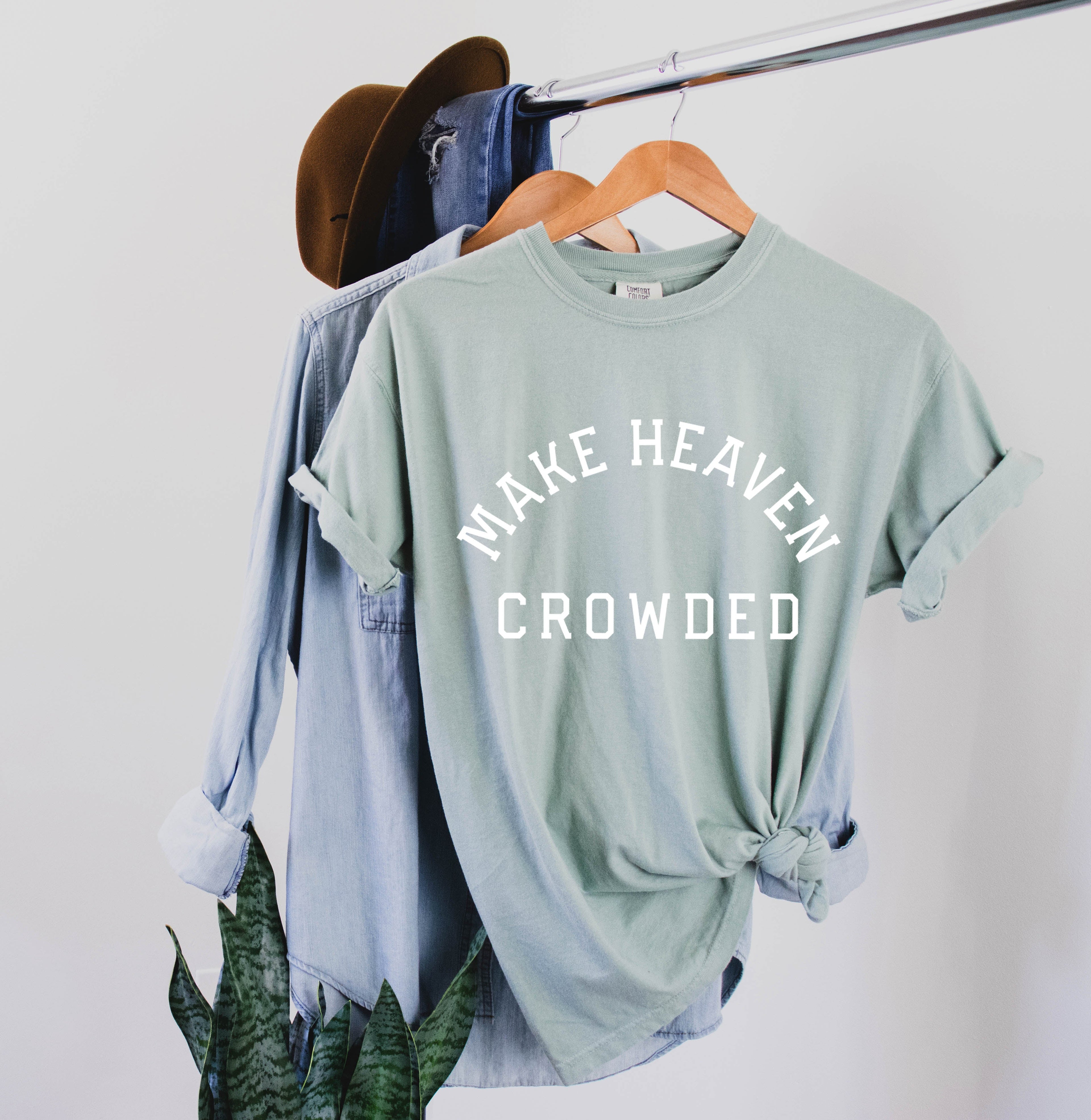 Seafoam green T-shirt with “Make Heaven Crowded” graphic on front